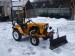 Traktor je připraven na odklízení sněhu